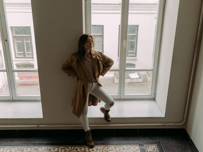 Shadow of a person in a yoga pose on a wall